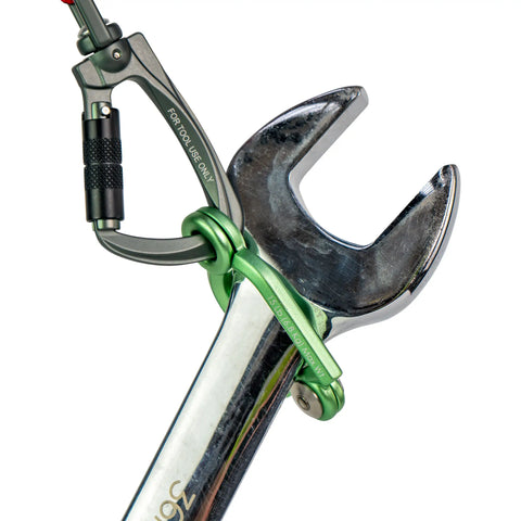 Close up of SnapLock tool connector applied to a spanner with carabiner from tool tether.